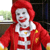 Rainbow Squared, Year 5, Piece Thirty-Five: 15. Yellow Red. An animated gif comprised of seven other animated gifs from the internet in a single loop. This includes a red-clad Ronald McDonald giving a double thumbs-down in yellow gloves, followed by an anthropomorphic computer-animated pizza slice with pepperoni breasts staring at the camera, followed by a plate of spaghetti being liberally sprinkled with mounds of parmesan cheese, followed by a jar of Gulden’s mustard puking out of a mouth-shaped hole in the top with googly eyes, followed by a hamburger/mustard/ketchup gun spitting out pickles, followed by Homer Simpson feeding a slice of pizza directly into his belly with a face drawn on it while Bart Simpson looks on, followed by Disney’s Cinderella going from rags to a melting ball gown made of cheese and pepperoni.